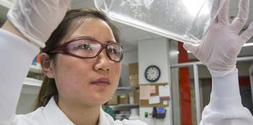 Scientist with beaker