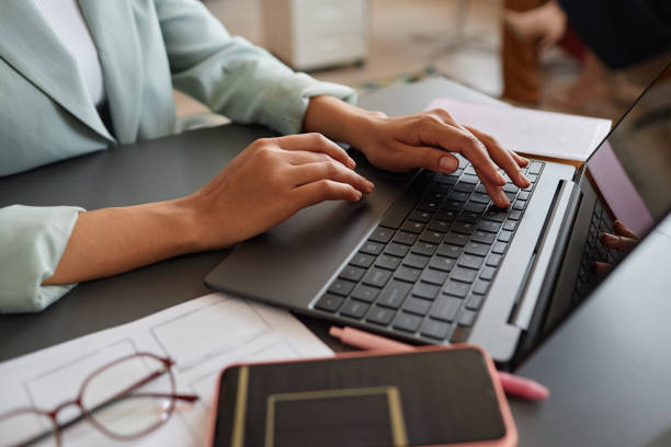 Typing on laptop